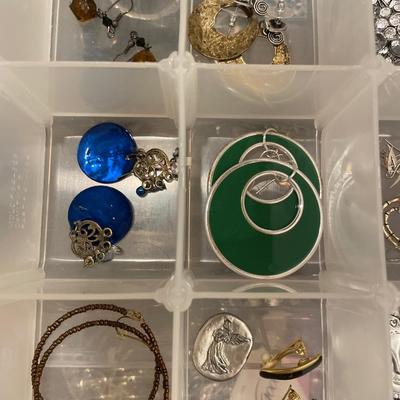 Plastic container of earrings and more