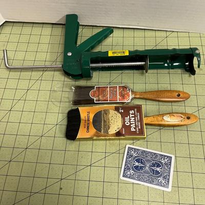 Caulk Gun and Paint Brushes
