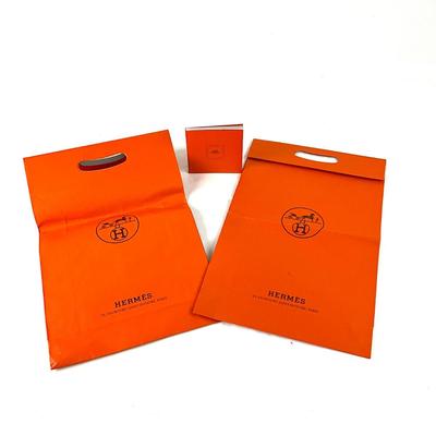 222 Two Authentic HÃˆRMES Orange Folding Handle Bags with Singular Knotting Book