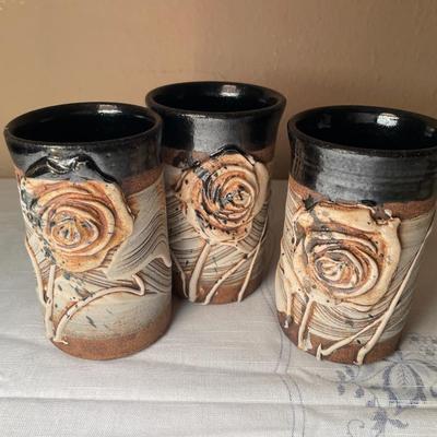 Floral ceramic pitcher and 3 cups