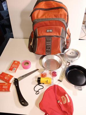 Orange backpack / bug out bag with contents - cookware - and survival goods