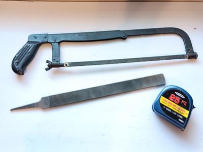 Hacksaw - 25"-foot tape measure - and a new file