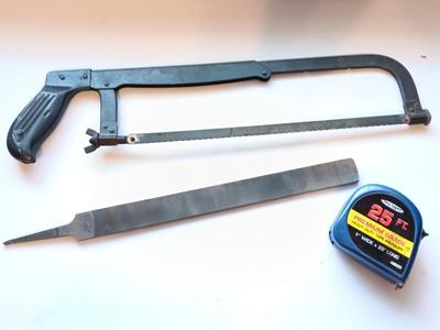Hacksaw - 25"-foot tape measure - and a new file