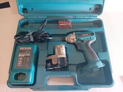 Makita 6932FD 14-volt hammer drill in molded case with accessories