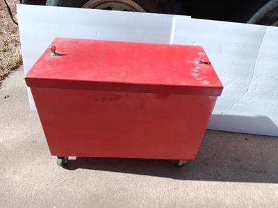Locking metal box lined with Masonite wood.
