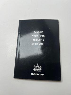 BANKSY- Banging Your Head Against A Brick Wall