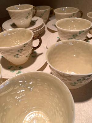 Set of 11 Belleek teacups and 11 saucers
