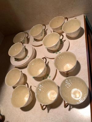 Set of 11 Belleek teacups and 11 saucers