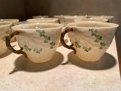 Set of 11 Belleek teacups and 11 saucers