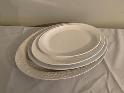 Assortment of large white serving platters