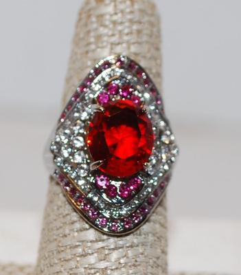 Size 7 Â½ Large Ruby Red Oval Cut Stone with Multiple Accent Bands of Purple & Clear Stones (7.0g)