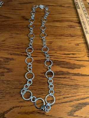 Group of silver color circle necklaces, Chicos