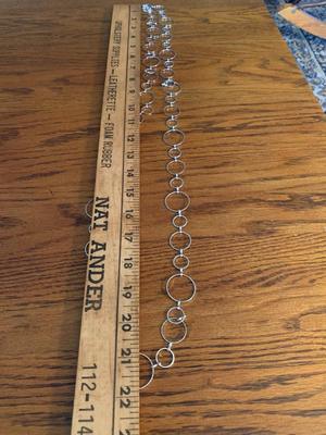 Group of silver color circle necklaces, Chicos