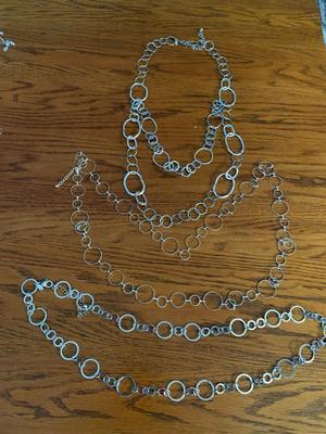 Group of silver color circle necklaces, Chicos