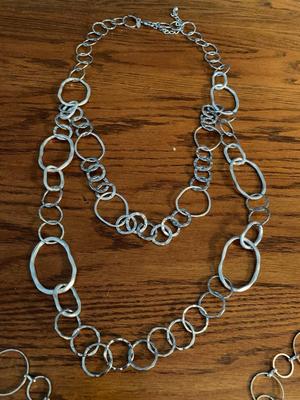 Group of silver color circle necklaces, Chicos