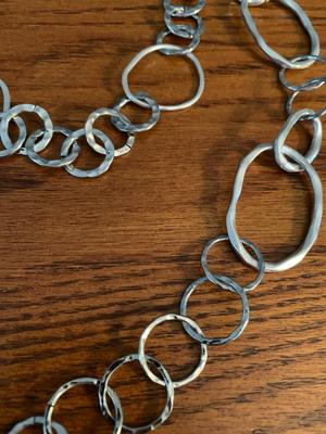Group of silver color circle necklaces, Chicos