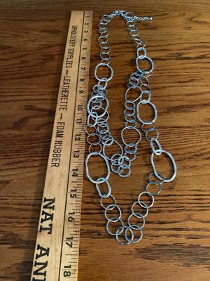Group of silver color circle necklaces, Chicos