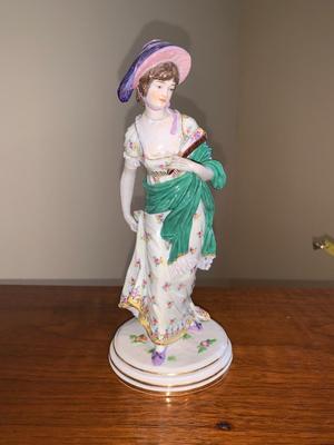 Porcelain figure of woman with shawl and hat, Meissen Crossed Swords Mark
