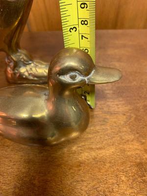 2 Small Vintage brass ducks. one landing and one swimming