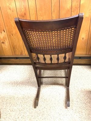 Antique caned rocking chair