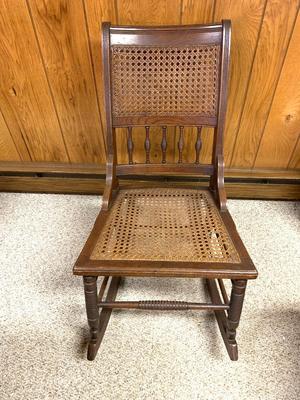 Antique caned rocking chair