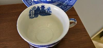 Blue and white flow blue cup and saucer with stand