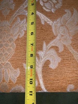 small upholstered footstool with hinged top