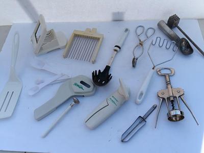 Assortment of mostly white handed Kitchen utensils -