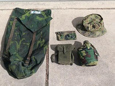 Vector pack systems camo canvas bag with camouflage hat and pouch and canteen.