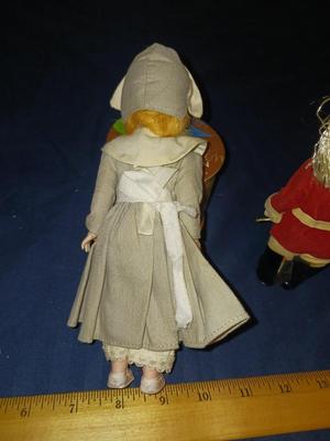 SLEEPY EYED PILGRIM LADY AND A BRITISH SOLDIER W/BRASS HELMET