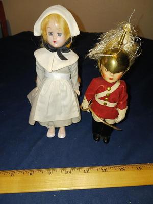 SLEEPY EYED PILGRIM LADY AND A BRITISH SOLDIER W/BRASS HELMET