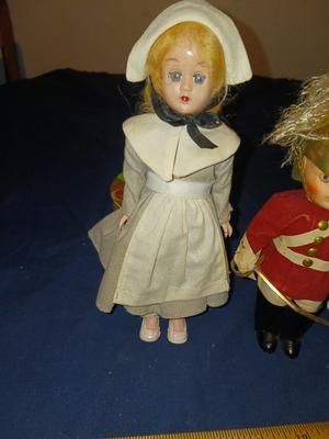 SLEEPY EYED PILGRIM LADY AND A BRITISH SOLDIER W/BRASS HELMET