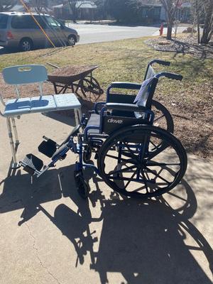 NEW WHEELCHAIR AND A SHOWER SEAT