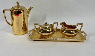 Coffee or Tea Pot with sugar bowl, creamer, and tray Gold Porcelain 1938