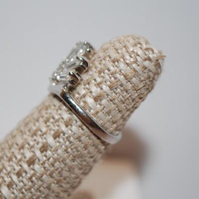 Size 5 - 4 Baguettes & 3 Round Cubic Zirconia Ring on a Silver-Tone Band (2.5g)