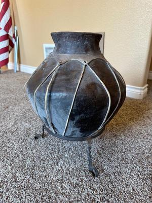 LARGE RAWHIDE BOUND CLAY POT ON IRON STAND