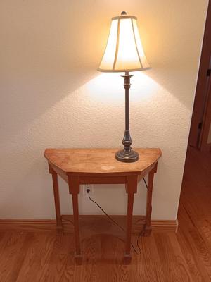 Antique wooden flat backed entry-way table with electric black accent lamp
