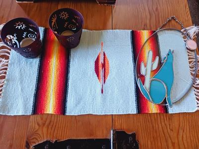STAINED GLASS COYOTE, METAL CANDLE HOLDERS AND A WOVEN TABLE RUNNER