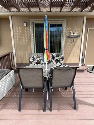 PATIO TABLE WITH UMBRELLA AND 4 PATIO CHAIRS WITH CUSHIONS