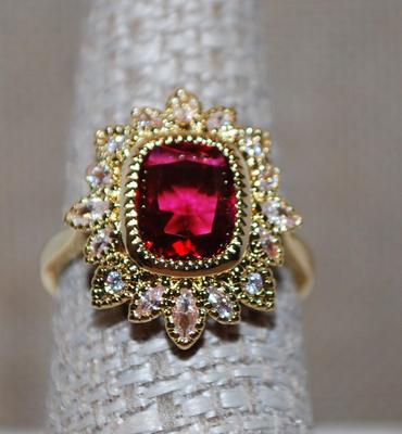 Size 7¼ Red Cushion Cut Ring in a Crown Style Setting on a Gold Tone Band (4.1g)