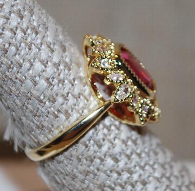 Size 7¼ Red Cushion Cut Ring in a Crown Style Setting on a Gold Tone Band (4.1g)