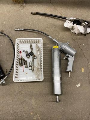 Air actuated and pistol grip grease gun with spare parts