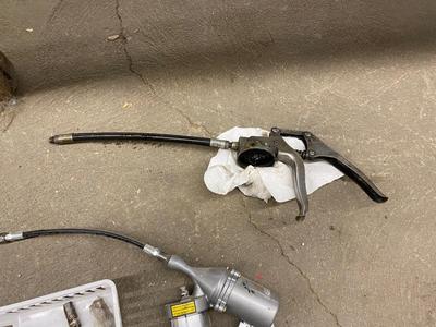 Air actuated and pistol grip grease gun with spare parts