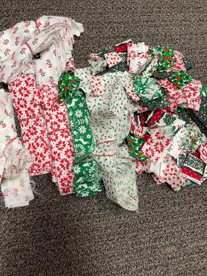 Lot of Christmas Holiday Print Material cut into stripes and squares, and other shapes for quilting