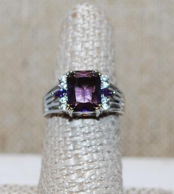 Size 7 Deep Purple Cushion Cut Center Stone Ring with Clear Accents on a Silver Tone Band (3.7g)
