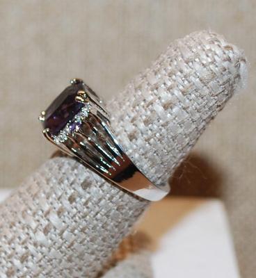 Size 7 Deep Purple Cushion Cut Center Stone Ring with Clear Accents on a Silver Tone Band (3.7g)