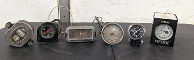 Ford Model A Oval Speedometer, Deluxe Clock, and Varied Gauges