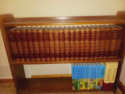 SMALL BOOKCASE FILLED WITH ENCYCLOPEDIAS