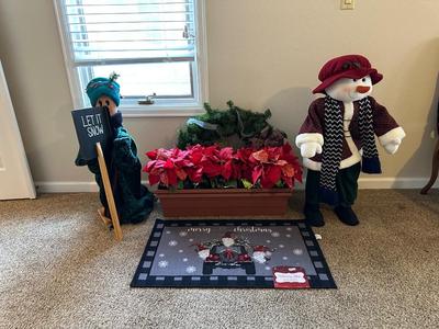 FREE STANDING SNOWMAN AND CARTOON CHARACTER, CHRISTMAS HOLIDAY RUG, LARGE WREATH AND 2 RECTANGLE PLANTERS WITH CHRISTMAS THEMED FAUX FLOWERS