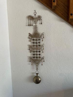 ORNATE METAL WALL ART FROM THE PHILIPPINES AND WOODEN STACKING STOOLS WITH WOVEN TOPS